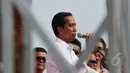 Presiden Jokowi saat memberikan kata sambutan di hadapan ratusan relawannya saat menghadiri Jambore Komunitas Juang Relawan Jokowi di Bumi Perkemahan Cibubur, Jakarta, Sabtu (16/5/2015). (Liputan6.com/Johan Tallo)