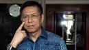 Anggota Komisi VII DPR, Mulyadi menunjukkan luka di wajahnya usai melaporkan kasus pemukulan dirinya oleh rekannya Mustofa Assegaf kepada Ketua DPR Setya Novanto di Kompleks Parlemen, Jakarta, Kamis (9/4/2015). (Liputan6.com/Andrian M Tunay)