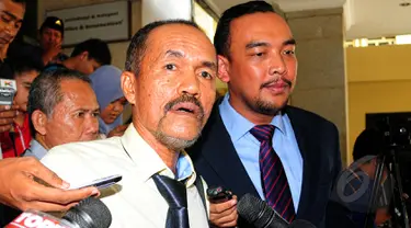 Hakim Sarpin Rizaldi usai menjalani pemeriksaan di Bareskrim, Jakarta, Senin (30/3/2015). Sarpin diperiksa sebagai saksi kasus pencemaran nama baik Ketua Komisi Yudisial Suparman Marzuki dan anggota KY Taufiqurrohman Syahuri.(Liputan6.com/Yoppy Renato)