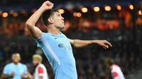 Bek John Stones mencatatkan namanya pada deretan top scorer Manchester City dengan tiga gol untuk semua kompetisi. (AFP/Emmanuel Dunand)