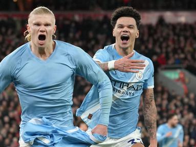 Pemain Manchester City, Erling Haaland, melakukan selebrasi setelah mencetak gol ke gawang Liverpool pada laga Liga Inggris di Stadion Anfield, Senin (9/2/2026) dini hari WIB. (AP Photo/Jon Super)