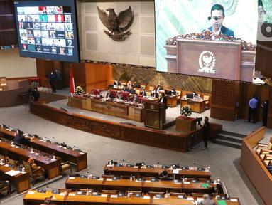 Suasana rapat paripurna ke-14 masa persidangan III tahun sidang 2021-2022 di Gedung Nusantara II, Kompleks Parlemen, Senayan, Jakarta, Selasa (8/2/2022). Agenda rapat paripurna DPR hari ini tertuang dalam surat nomor B/3164/PW.11.01/2/2022. (Liputan6.com/Angga Yuniar)