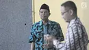 Ekspresi tersangka Wali Kota Mojokerto Masud Yunus usai menjalani pemeriksaan di Gedung KPK, Jakarta, Rabu (7/2). Meski sudah berstatus tersangka, Masud hingga kini belum ditahan. (Liputan6.com/Herman Zakharia)