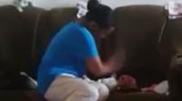 Polisi telah menangkap seorang ibu yang terekam kamera memukul bayinya yang tak berdosa.