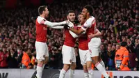 Perayaan gol pemain Arsenal yang dicetak Ramsey pada leg 1, babak perempat final Liga Europa yang berlangsung di Stadion Emirates, London, Jumat (12/4). Arsenal menang 2-0 atas Napoli. (AFP/Ben Stansall)