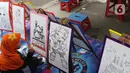 Seorang anak mengikuti lomba mewarnai selama Festival Tugu Pancoran di Jakarta, Minggu (1/12/2019). Festival Tugu Pancoran yang digelar setiap setahun sekali ini indetik dengan budaya betawi. (Liputan6.com/Herman Zakharia)