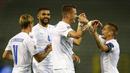 Pemain Islandia, Holmbert Fridjonsson, melakukan selebrasi usai mencetak gol ke gawang Belgia pada laga UEFA Nations League di Stadion King Baudouin, Rabu (9/9/2020). Belgia menang telak dengan skor 5-1. (AP/Francisco Seco)