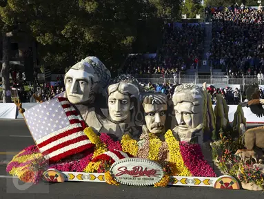 Sebuah mobil hias berbentuk wajah Presiden AS ikut berparisipasi di Rose Parade, Pasadena, California (1/1/2016). Acara Rose Parade menjadi acara yang dinantikan penduduk Pasadena setiap awal tahun (REUTERS / David McNew)