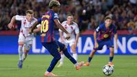 Pemain Barcelona Lamine Yamal ketika mencetak gol ke gawang Olympiacos di ajang Liga Champions. (MANAURE QUINTERO / AFP)