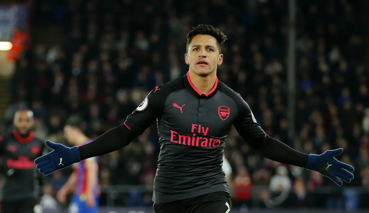 Alexis Sanchez pemain serbabisa. Ini diharapkan bisa juga terjadi di MU (AP/Alastair Grant)