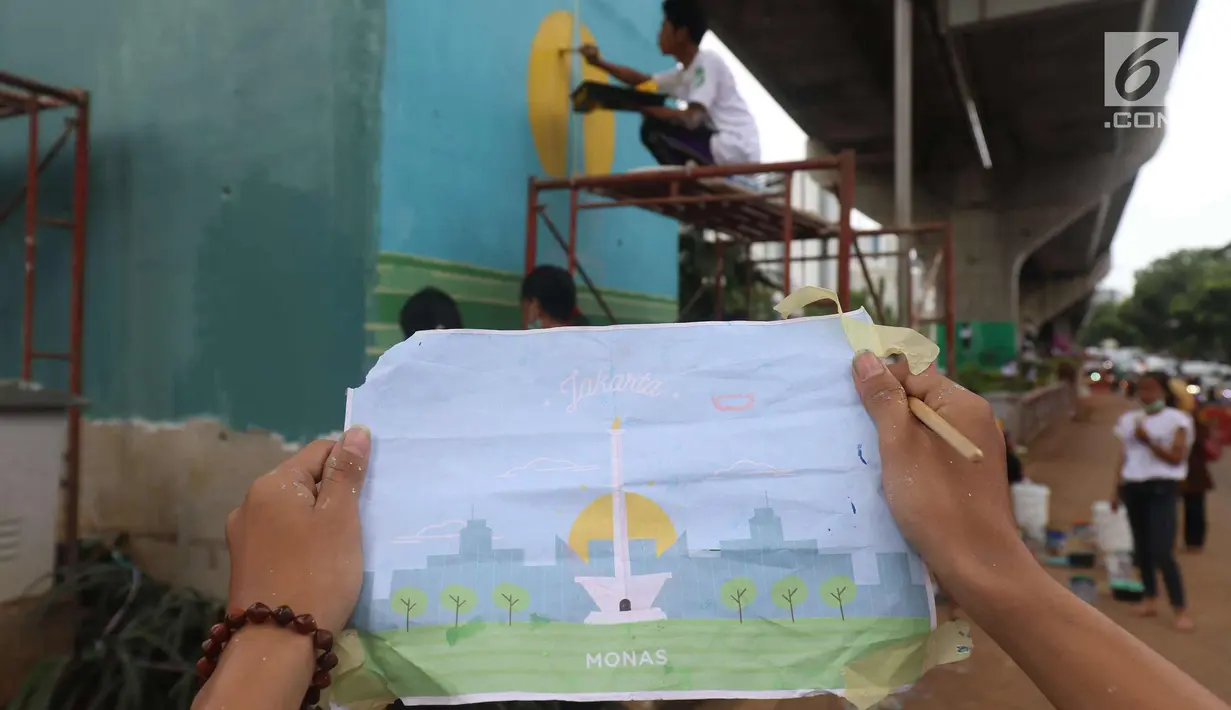 Siswa SMK N 46 Jakarta menunjukkan gambar Monas sebelum membuat mural di bawah kolong jalan layang non tol Kasablangka, Jakarta, Jumat (1/12). Mural tersebut di lakukan untuk mempercantik kawasan tersebut. (Liputan6.com/Angga Yuniar)