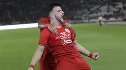 Striker Persija Jakarta, Marko Simic, melakukan selebrasi usai membobol gawang Geylang International FC pada laga uji coba di SUGBK, Jakarta, Minggu, (23/2/2020). Persija Jakarta menang dengan skor 3-1. (Bola.com/M Iqbal Ichsan)