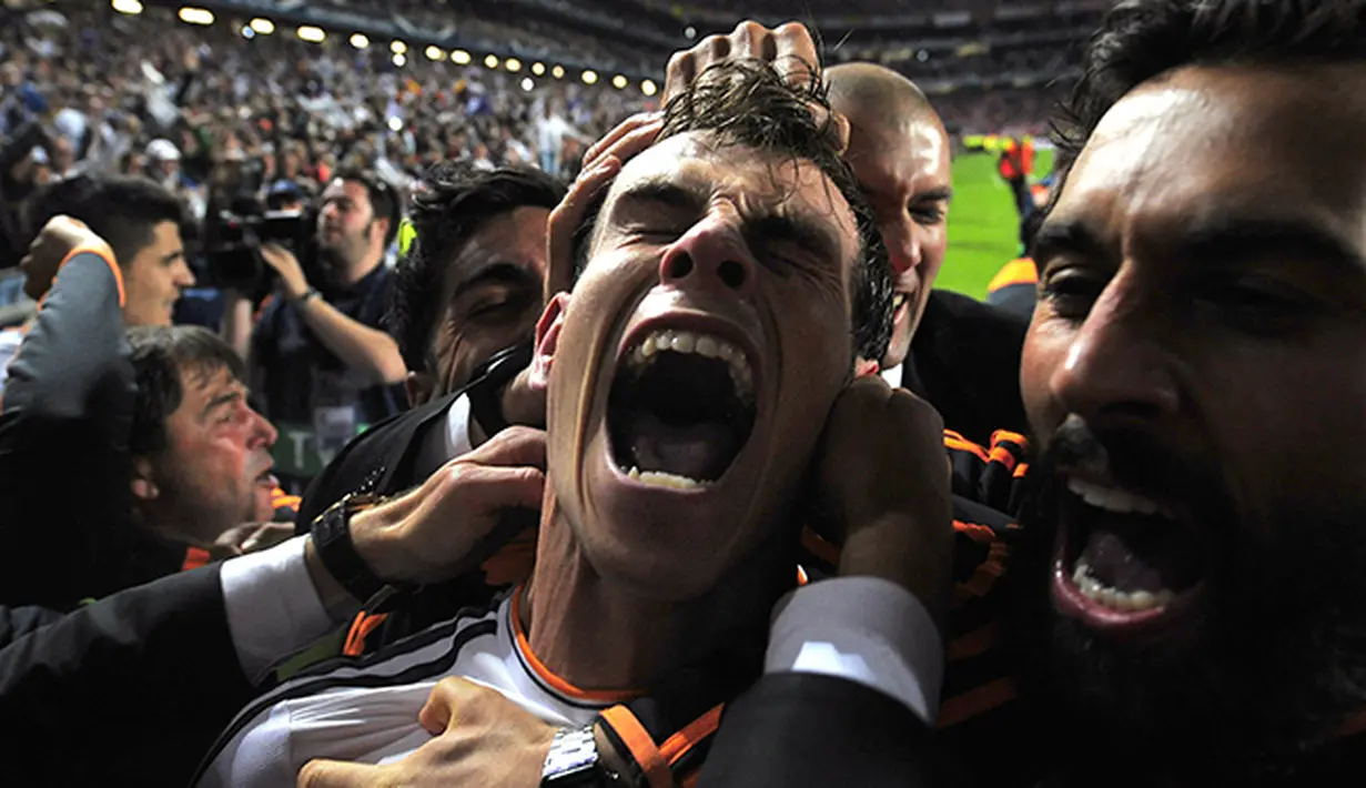 Ekspresi Gareth Bale setelah mencetak gol kedua Real Madrid pada laga final melawan Atletico Madrid di Lisbon Portugal 2014. (AP/Manu Fernandez)