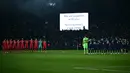 Para pemain mengheningkan cipta untuk para korban gempa bumi di Suriah dan Turki menjelang pertandingan Liga Champions antara PSG dan Bayern Muenchen di Parc des Princes di Paris, pada Februari 15 Agustus 2023. (AFP/Anne-Christine Poujoulat)