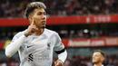 Pemain Liverpool, Roberto Firmino, melakukan selebrasi setelah mencetak gol ke gawang Arsenal pada laga Liga Inggris di Stadion Emirates, (9/10/2022). The Reds masih berusaha untuk memperpanjang kontrak Firmino yang akan habis di akhir musin ini. Sejak didatangkan ke Anfield pada tahun 2015 silam, Firmino sukses menjadi andalan Jurgen Klopp di lini serang. (AFP/Ian Kington)