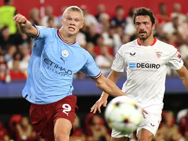 Erling Haaland tampil gemilang saat laga debutnya di Liga Champions bersama Manchester City. Ia berhasil melesatkan dua gol untuk kemenangan 4-0 The Cityzens. Atas torehan tersebut, Haaland kini mampu menciptakan rekor baru. Berikut daftarnya. (AFP/Thomas Coex)
