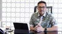 Direktur Utama Bank Fama, Tigor M. Siahaan berpose usai wawancara khusus dengan Liputan6.com di kawasan SCBD, Jakarta, Selasa (13/12/2022). (Liputan6.com/Herman Zakharia)