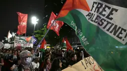 Berbagai aksi peringatan digelar di berbagai negara sejak Senin (7/10/2024) untuk memperingati satu tahun serangan Israel di Gaza. (NELSON ALMEIDA/AFP)