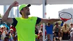 Petenis Kroasia, Ivo Karlovic berselebrasi setelah mengalahkan petenis Jepang, Yuichi Sugita di babak kedua turnamen Australia Terbuka 2018, Rabu (17/1). Karlovic muncul sebagai petenis tertua yang sukses melaju ke babak Australia Terbuka (AP/Ng Han Guan)