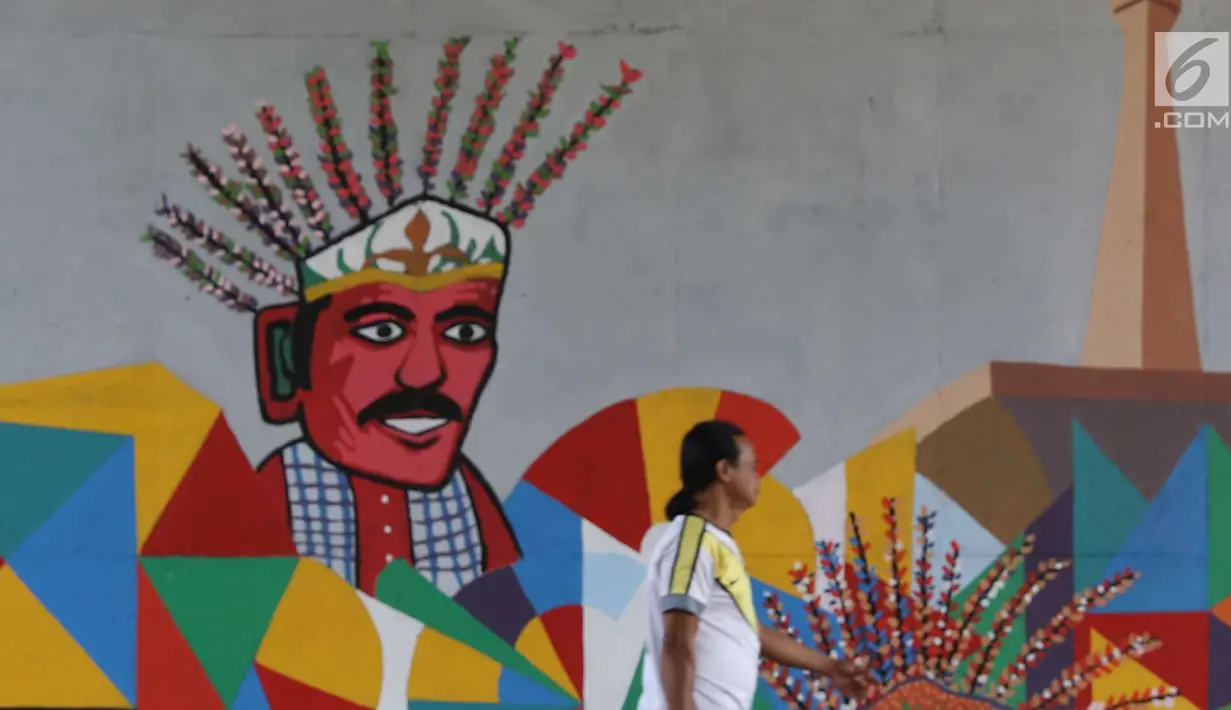 Warga melintas di samping mural bertema Asian Games 2018 di kolong flyover Universitas Indonesia, Depok, Jawa Barat, Jumat (27/7). Perhelatan Asian Games 2018 akan berlangsung di Jakarta dan Palembang. (Liputan6.com/Immanuel Antonius)