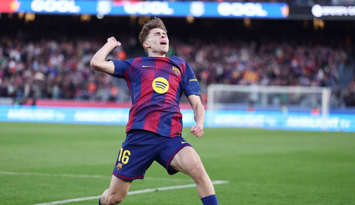 Gol Fermin Lopez pada menit ke-81 memastikan Barcelona meraih poin penuh. Tampak dalam foto, gelandang Barcelona asal Spanyol, Fermin Lopez, merayakan golnya selama pertandingan pekan ke-25 La Liga 2025/2026 melawan Levante UD di Stadion Camp Nou, Minggu 22 Februari 2026. (Josep LAGO/AFP)