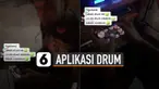 Aksi keren dan kreatif dilakukan oleh seorang pria menggunakan aplikasi bermain drum di handphone saat tampil ngeband.