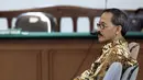 Ekspresi Heru Sulaksono saat menjalani sidang perdana di Pengadilan Tipikor, Jakarta, Senin (8/9/14). (Liputan6.com/Panji Diksana)
