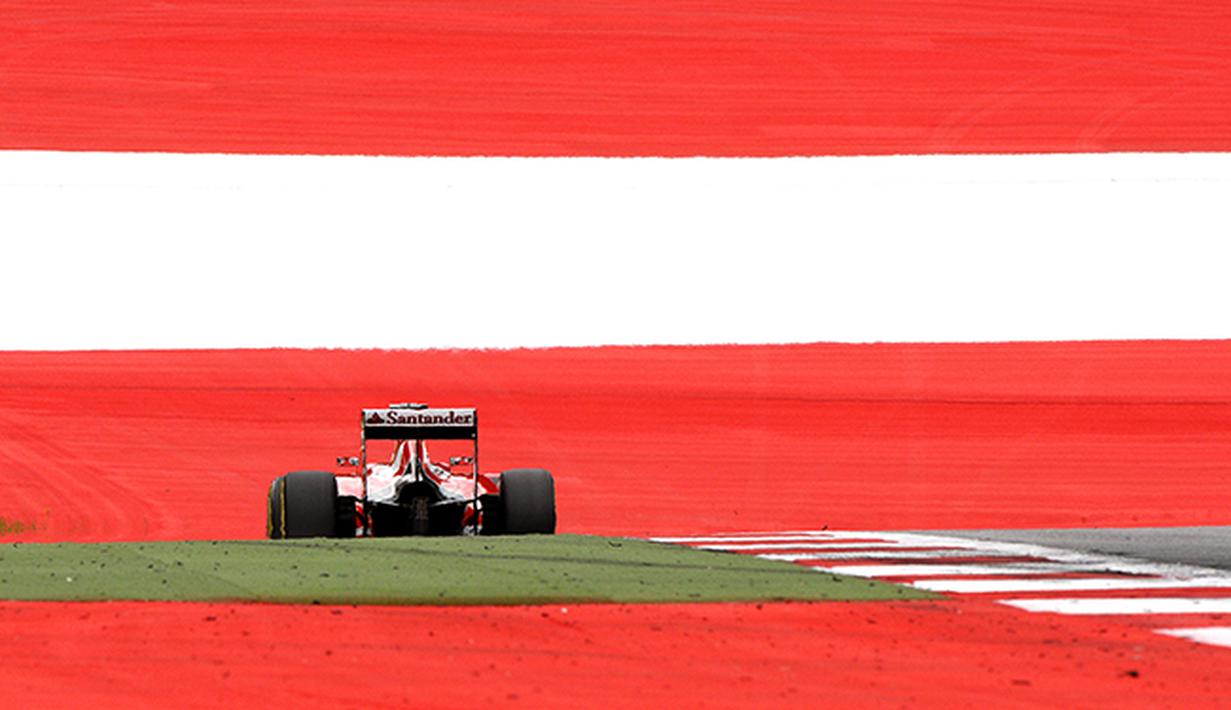 Sebastian Vettel pebalap Formula Satu dari tim Scuderia Ferrarri  beraksi di GP Austria. (EPA/Hans Klaus Techt)