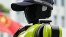 Robot ini dilengkapi dengan kecerdasan buatan (Artificial Intelligence), kamera definisi tinggi, dan LiDAR (Light Detection and Ranging). Tampak dalam foto, sebuah robot polisi humanoid di Hangzhou, provinsi Zhejiang Timur, Tiongkok pada Minggu 3 Mei 2026. (Agatha CANTRILL/AFP)
