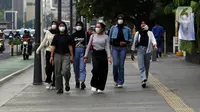Tapi, pemerintah tetap menganjurkan masyarakat untuk menggunakan masker jika merasa dalam keadaan sehat dan untuk melindungi diri. (Liputan6.com/Helmi Fithriansyah)