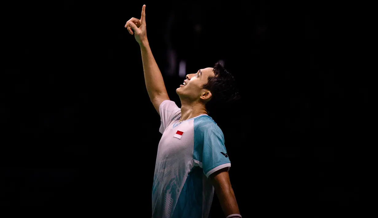 Pebulu tangkis Indonesia, Jonatan Christie merayakan kemenangannya di final tunggal putra melawan Anders Antonsen dari Denmark di turnamen bulu tangkis Korea Open di Suwon, Korea Selatan pada Minggu 28 September 2025. (ANTHONY WALLACE/AFP)