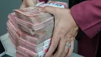 Rupiah Tembus 18.000, OJK Pastikan Tak Ada Bank Rush