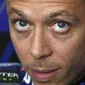 Valentino Rossi tak menunjukkan tanda-tanda bosan atau kehilangan motivasi meskipun telah 21 tahun berkiprah di ajang balap motor dunia. (AP/Hendrik Schmidt)