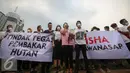 Artis dan aktivis menggelar aksi turun kejalan solidaritas #melawanasap di Patung Kuda kawasan Merdeka Barat, Jakarta, Jumat (9/10/2015). Aksi mendesak agar pemerintah segera bertanggung jawabnya untuk menanggulangi kebakaran. (Liputan6.com/Faizal Fanani)