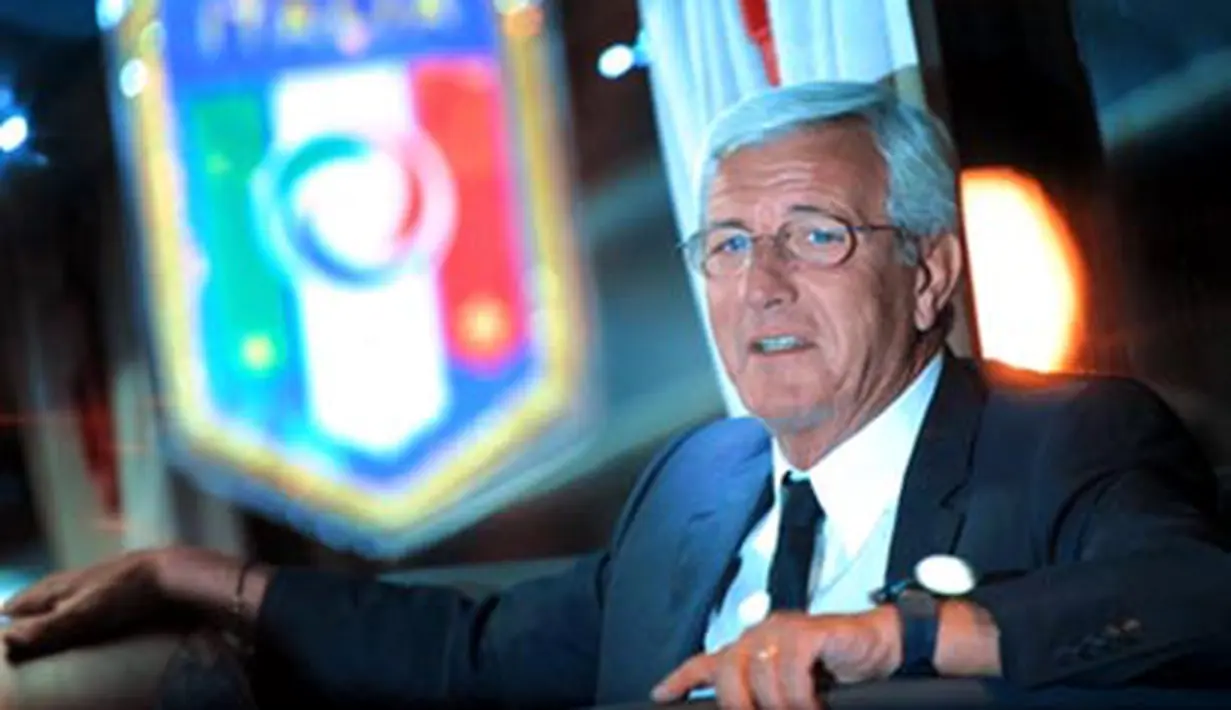 Coach of the Italian national football team Marcello Lippi watches after his team arriving at Sofia airport on October 10, 2008, ahead of Saturday's World Cup qualifier against Bulgaria. AFP PHOTO / DIMITAR DILKOFF