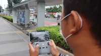 Pemprov DKI menggelar Operasi Tangkap Tangkap (OTT) secara konvensional dengan membuka posko dan menggunakan drone terhadap pelanggar yang membuang sampah sembarangan. (Dok. Merdeka.com)