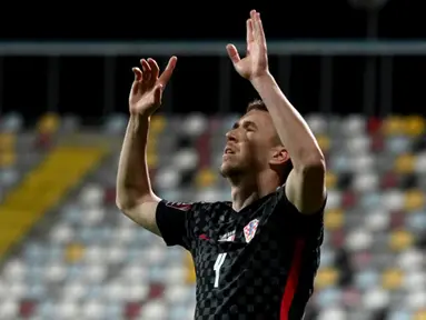 Pemain Kroasia Ivan Perisic melakukan selebrasi usai mencetak gol ke gawang Malta pada pertandingan Grup H kualifikasi Piala Dunia 2022 di Stadion Rujevica, Rijeka, Kroasia, Selasa (30/3/2021). (Denis LOVROVIC/AFP)