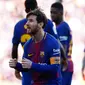 Penyerang Barcelona, Lionel Messi melakukan selebrasi usai mencetak gol ke gawang Athletic Bilbao di stadion Camp Nou, Spanyol (18/3). Messi berjoget usai mencetak gol dan membawa timnya menang 2-0. (AP Photo / Manu Fernandez)