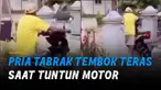 Baru sampai di mulut gerbang, motor matic itu melaju kencang hingga pria itu terseret dan menabrak tembok teras.