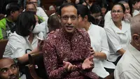 Mantan Menteri Pendidikan, Kebudayaan, Riset, dan Teknologi (Mendikbudristek), Nadiem Anwar Makarim, yang juga salah satu pendiri platform pembayaran dan perusahaan transportasi daring di Indonesia, bereaksi sebelum dimulainya sidang pembacaan tuntutan di Pengadilan Tindak Pidana Korupsi Jakarta, Rabu 13 Mei 2026. (AP Photo/Tatan Syuflana)