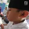 Anak-anak membaca kitab suci Al-Quran di Kampung Quran Alkholidin Cinere,  Depok, Senin (13/5/2019). Momentum bulan Ramadhan 1440 H dimanfaatkan anak-anak usai pulang sekolah untuk membaca dan menghapal Quran secara bersama-sama untuk menambah amalan ibadah puasa. (merdeka.com/Arie Basuki)