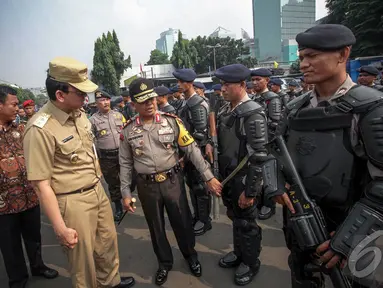Pelaksana Tugas Gubernur DKI Jakarta Basuki Tjahaja Purnama hadir di apel kesiapan pengamanan pelantikan Presiden, Jakarta, Kamis (16/10/2014) (Liputan6.com/Faizal Fanani)