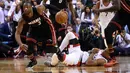 Miami Heat guard Dwyane Wade (3) menggiring bola saat dihadang Toronto Raptors guard DeMar DeRozan (10) pada NBA Playoffs di Air Canada Centre, Toronto, Selasa (3/5/2016). (Reuters/Mandatory/Dan Hamilton-USA TODAY Sports)