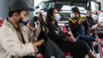Seorang wanita menunggu untuk mengikuti rapid test antigen di Stasiun Gambir, Jakarta, Rabu (23/12/2020). Dari Kemarin Selasa (22/12/2020) Sampai sekarang tercatat Seribuan calon penumpang mengikuti rapid test tersebut. (Liputan6.com/Johan Tallo)