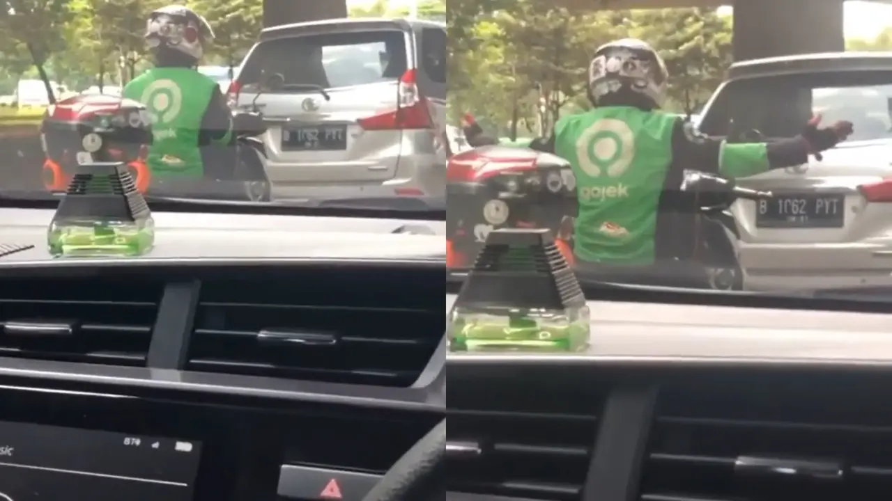 Usir Bosan di Lampu Merah, Driver Ojol Ini Asyik Joget di Atas Motor