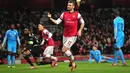 Selebrasi Pemain Arsenal Olivier Giroud Setelah Mencetak gol ke gawang Olympique Marseille pada Liga Champions Grup F antara Arsenal dan Olympique de Marseille di Stadion Emirates (27/11/2013).(AFP/Glyn Kirk)