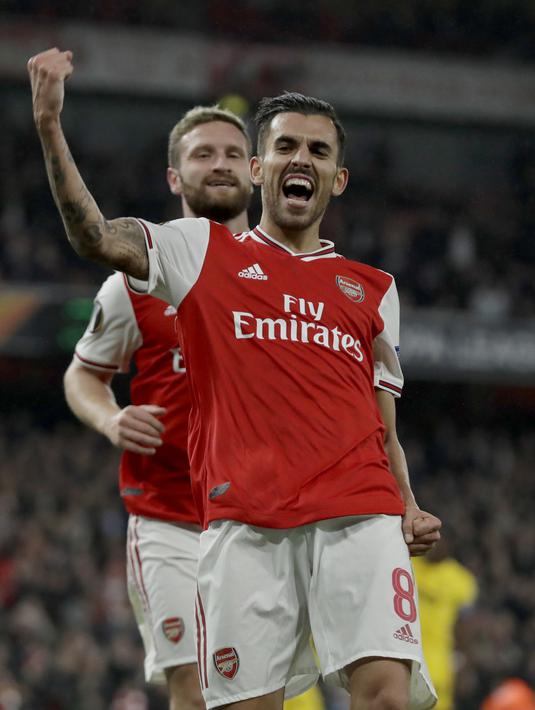 Gelandang Arsenal, Dani Ceballos berselebrasi usai mencetak gol ke gawang Standard Liege pada lanjutan pertandingan grup F Liga Europa di Stadion Emirates, London (3/10/2019). Arsenal menang telak 4-0 atas Standard Liege. (AP Photo/Matt Dunham)