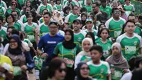 Ribuan peserta mengikuti lomba lari Milo Jakarta International 10K di kawasan Rasuna Epicentrum, Jakarta, Minggu (14/7/2019). Milo Jakarta International 10K diikuti oleh sekitar 16 ribu peserta. (Liputan6.com/Faizal Fanani)