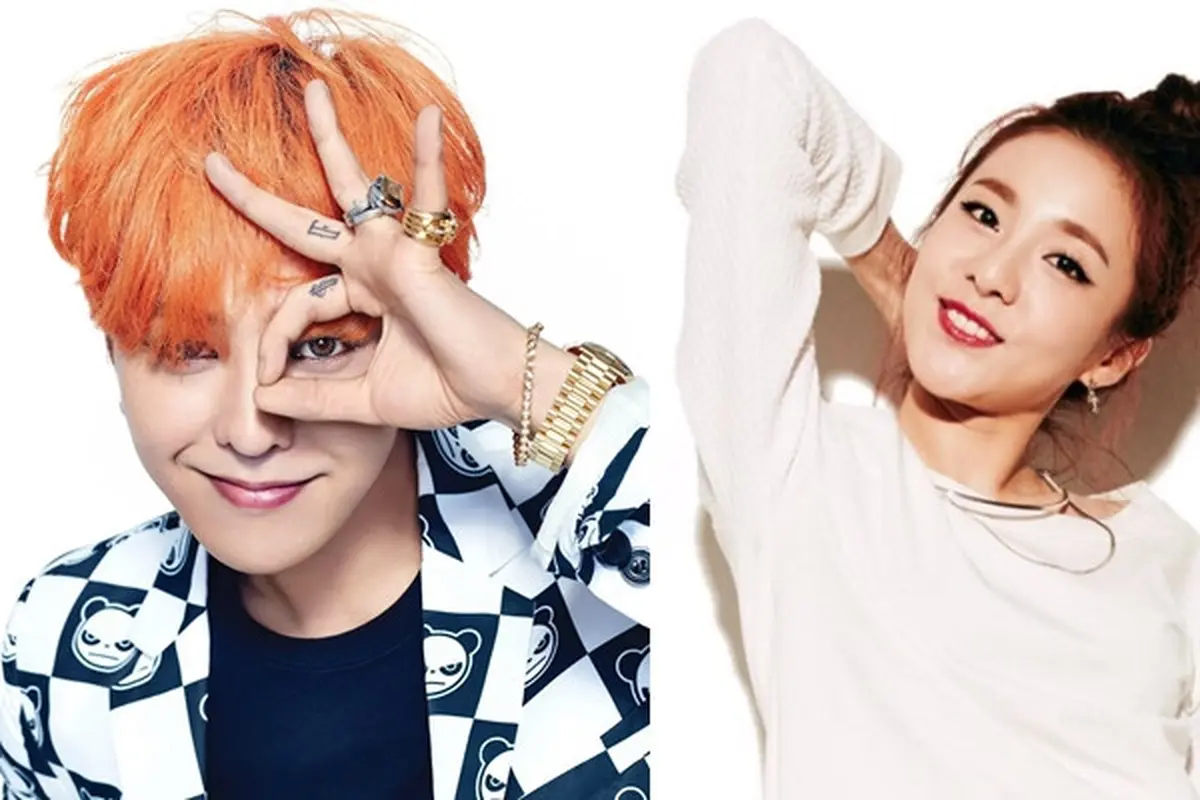 G-Dragon kepergok mencium seorang wanita yang diduga Sandara Park.