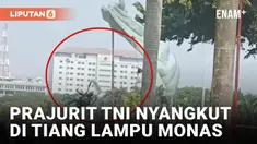 Viral! Penerjung Payung TNI Nyangkut di Tiang Lampu Monas